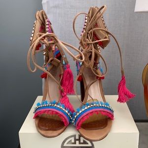 Colorful funny with any outfit. Missing one of the pink tassel